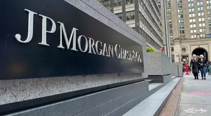 JPMorgan net income falls as bank sets aside more money to cover potential bad loans