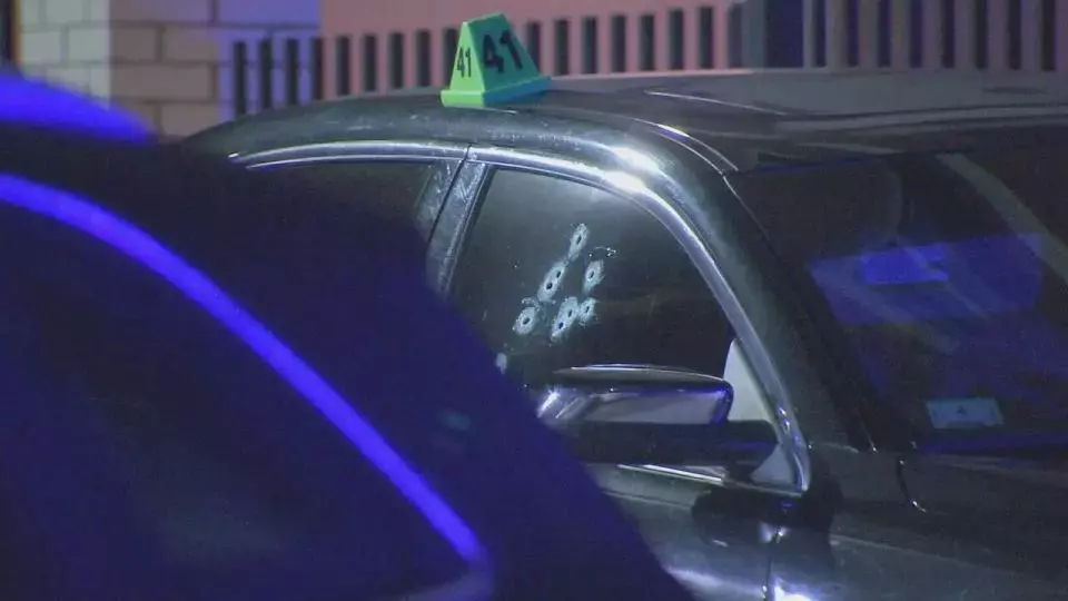 Boston shooting leaves car riddled with bullets, ground littered with evidence markers