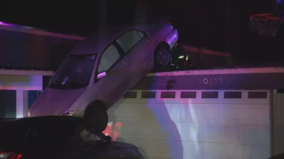 Vehicle Plunges Off Garage Roof in Arbor Heights