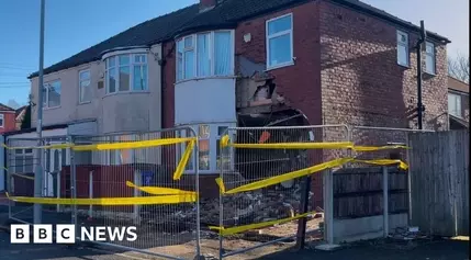 Mercedes Crash Shatters Home's Facade in Manchester