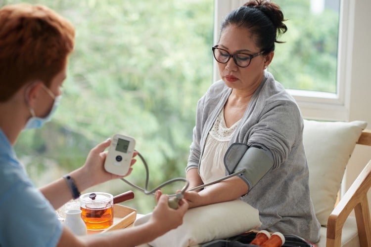 Woman getting her blood pressure taken