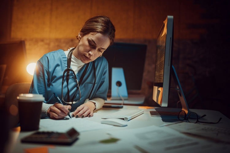 Female night nurse at computer