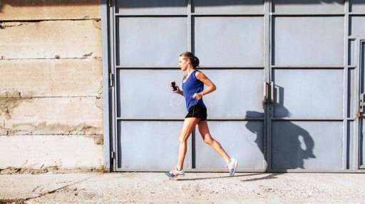 Older female jogging outdoors